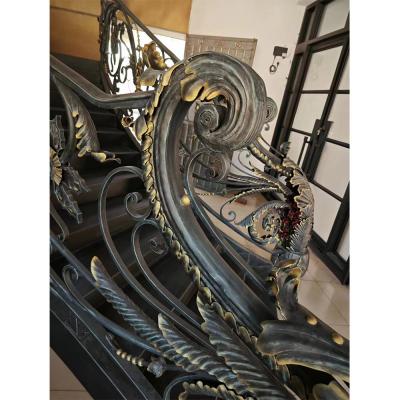 Classical rose bouquet decorating wrought iron handrail, staircase