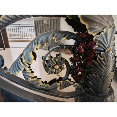 Classical rose bouquet decorating wrought iron handrail, staircase