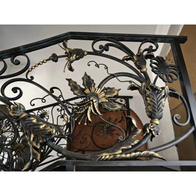 Classical rose bouquet decorating wrought iron handrail, staircase